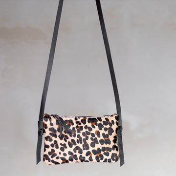 Anouk Cowhide Crossbody by Clemés in Panther, three-quarter studio shot on grey background