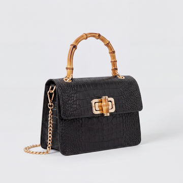 Black Clotilde Bamboo Croc Handbag by Clemés, studio shot