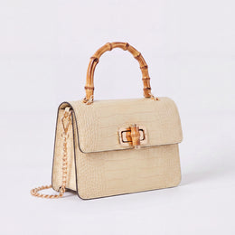 Cream Clotilde Bamboo Croc Handbag by Clemés, studio shot
