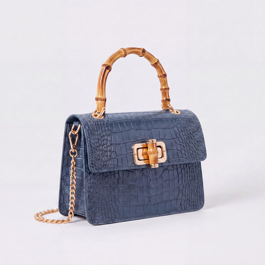 Denim Blue Clotilde Bamboo Croc Handbag by Clemés, studio shot