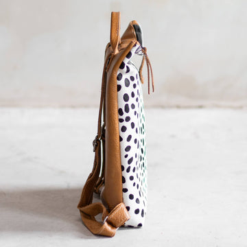 Sandra Cowhide & Leather Backpack by Clemés in Dalmatian print, side view