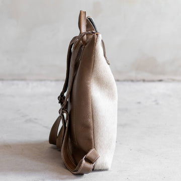Sandra Cowhide & Leather Backpack by Clemés in Champagne, side view