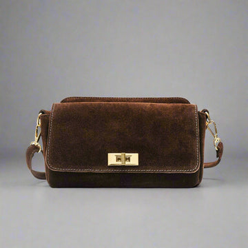 Iliane Suede Bag in Chocolate, three-quarter studio shot on grey background