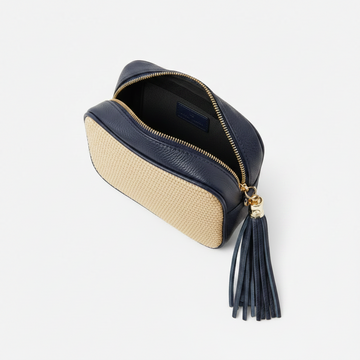 Éloise Raffia & Leather Tassel Camera Crossbody Bag by Clemés in Navy, studio shot with tassel