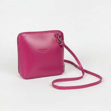 Beatrice Leather Crossbody Bag by Clemés in Fuchsia, three-quarter studio shot on grey background