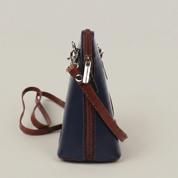 Beatrice Leather Crossbody Bag by Clemés in Navy, studio shot with contrast strap