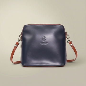 Beatrice Leather Crossbody Bag by Clemés in Navy, studio shot on beige background
