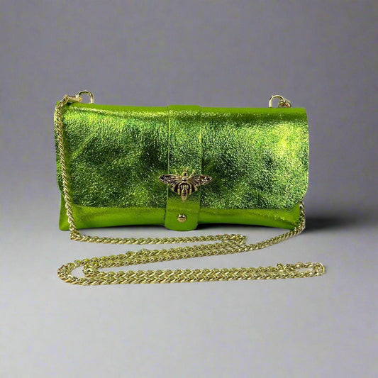 Anima Suede Leather Metallic Clutch Shoulder Bag by Clemés in Apple Green, three-quarter studio shot on grey background