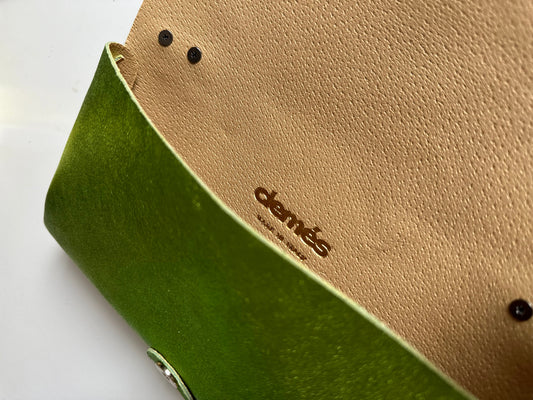 Anima Suede Leather Metallic Clutch Shoulder Bag by Clemés in Apple Green, flat lay showing the nude leather flap