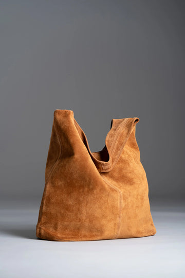 Silvia Suede Slouch Hobo Bag by Clemés in Caramel, studio shot