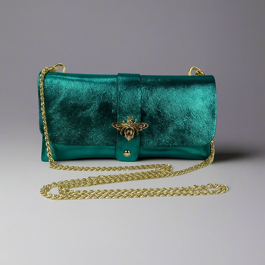 Anima Suede Leather Metallic Clutch Shoulder Bag by Clemés in Teal, three-quarter studio shot on grey background