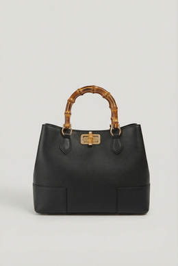 Ginevra Bamboo-Handle Leather Bag by Clemés in Black, three-quarter studio shot on grey background