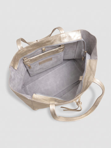 Carlotta oversized leather tote by Clemés in Champagne Gold metallic leather, interior view showing the light grey suede lining and zip pocket