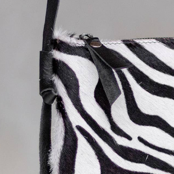Anouk Cowhide Crossbody by Clemés in Zebra, texture and strap detail