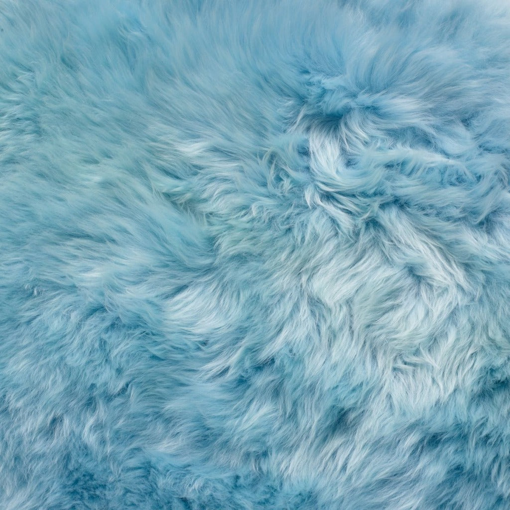 Close-up of the soft sky blue Sea Foam sheepskin wool