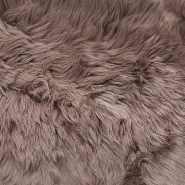 Close-up of the long, dense taupe New Zealand sheepskin wool