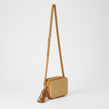 Éloise Raffia & Leather Tassel Camera Crossbody Bag by Clemés in Tan, studio shot with long strap