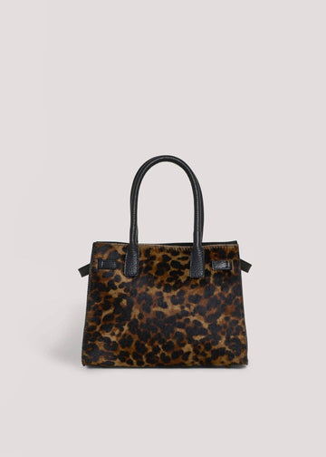 Leonora leopard calf hair top-handle bag, straight-on front view with twin rolled black leather handles