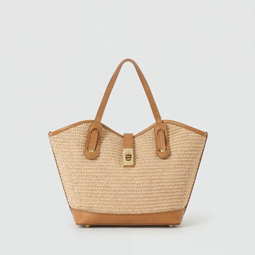 Sorrento raffia and tan leather tote, front view on a light grey studio background