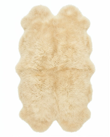 Champagne quad sheepskin rug flat lay on white background