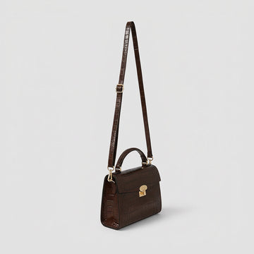 Margot Croc crossbody bag, three-quarter angle with strap raised, studio product photo on grey background
