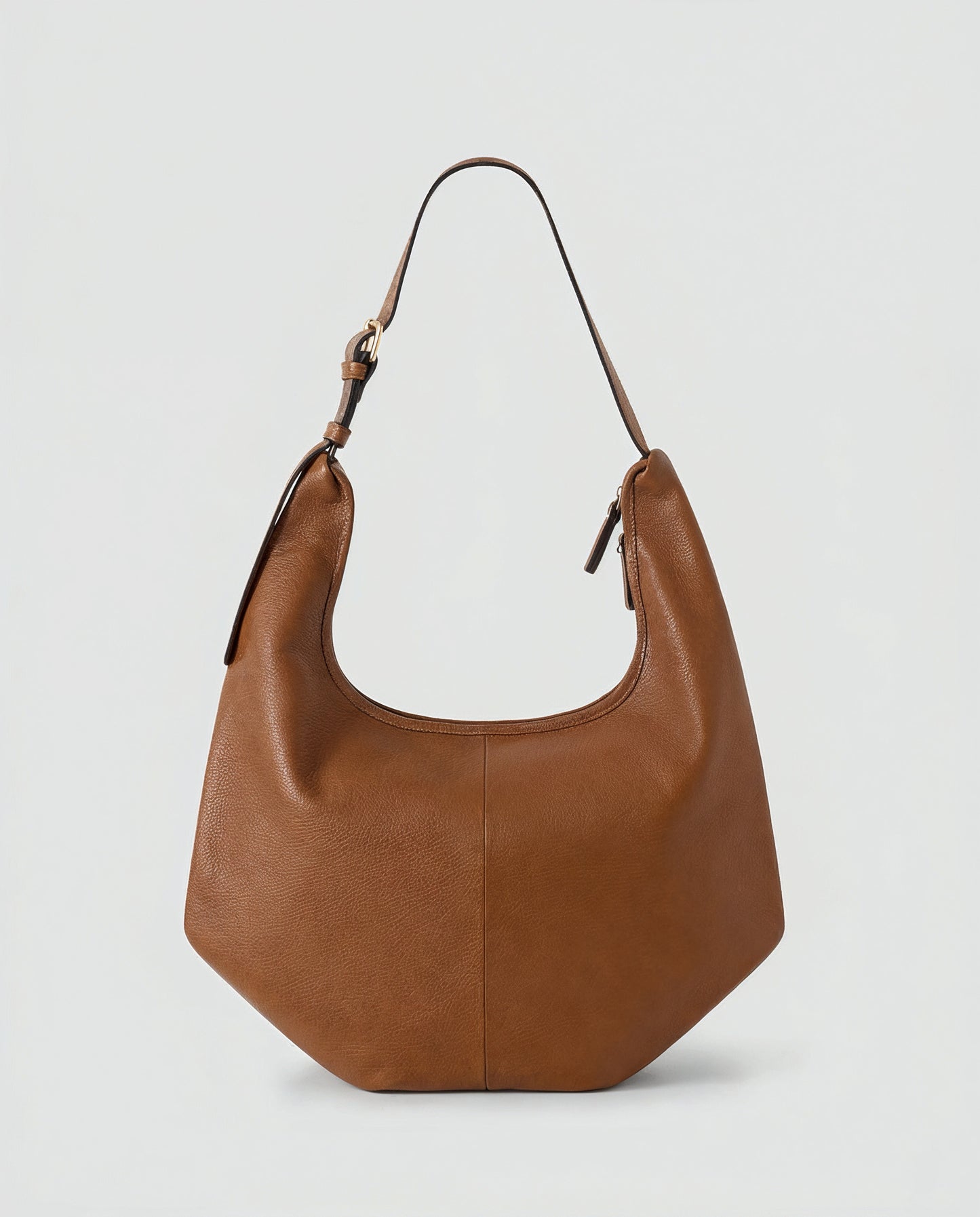 Ludovica leather hobo shoulder bag in tan on a light grey studio background