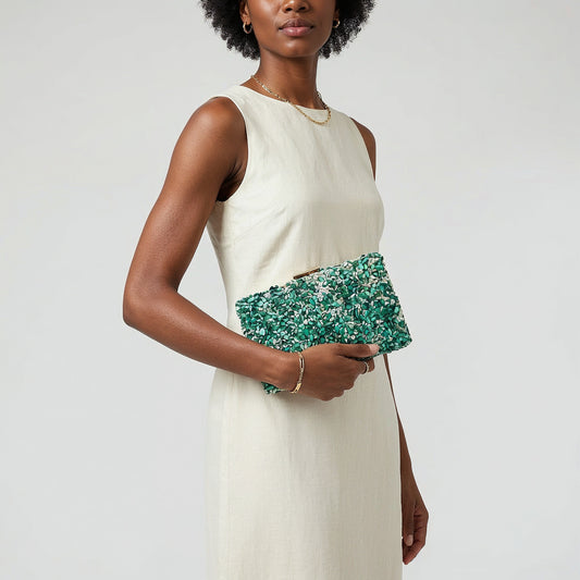 Model with the Turquoise Gemma Natural Stone Box Clutch tucked under her arm, studio shot