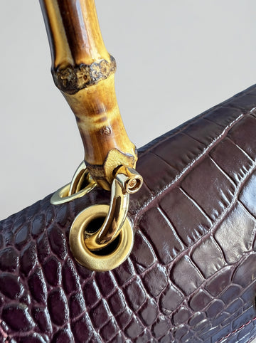 Clotilde Bamboo Croc Handbag by Clemés - Burgundy - close-up of bamboo handle and gold ring hardware