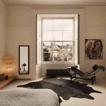 Black cowhide rug in an elegant Georgian bedroom