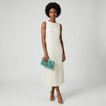 Model holding the Turquoise Gemma Natural Stone Box Clutch at her side, studio shot