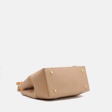 Medium Ginevra bag base and side profile showing protective metal feet