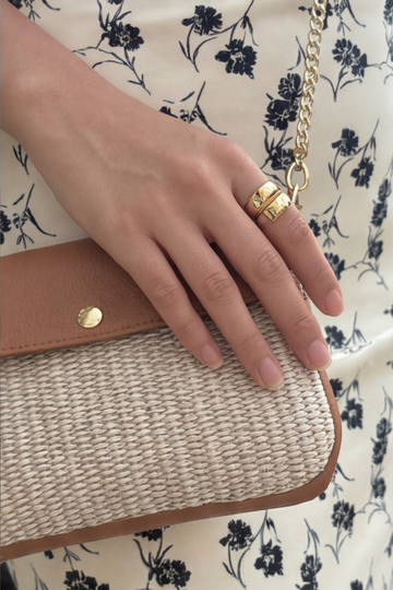 Élodie Raffia & Leather Flap Crossbody Bag by Clemés in Oyster, held in hand
