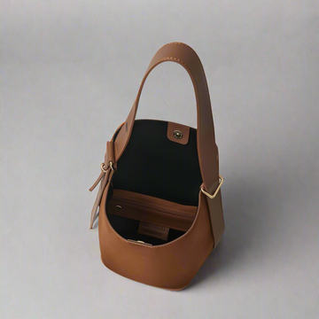Serena Suede & Leather Bucket Shoulder Bag by Clemés in Tan, studio shot