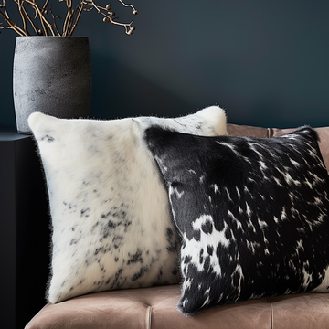 Close-up of black and white cowhide cushion hair