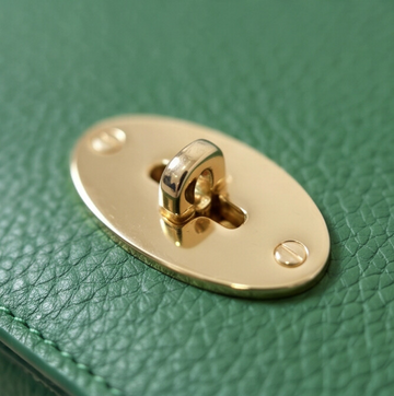 Chiara Leather Crossbody by Clemés in Green, gold twist-lock clasp detail