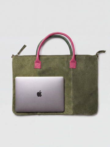 Milano Max Suede Bag in Olive by Clemés, flat overhead studio shot with a 13-inch MacBook lying on the bag showing how much it swallows