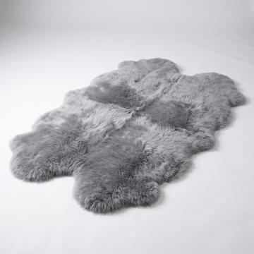 Quad New Zealand Sheepskin Rug & Throw in Grey Mist, studio shot