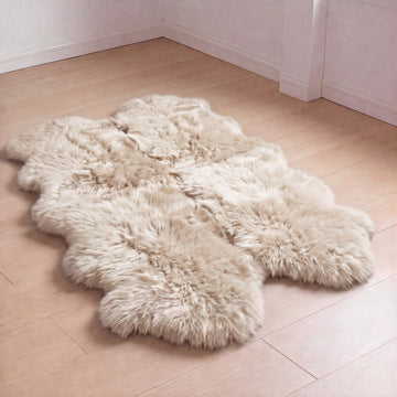 Linen quad New Zealand sheepskin rug laid on a light wood floor