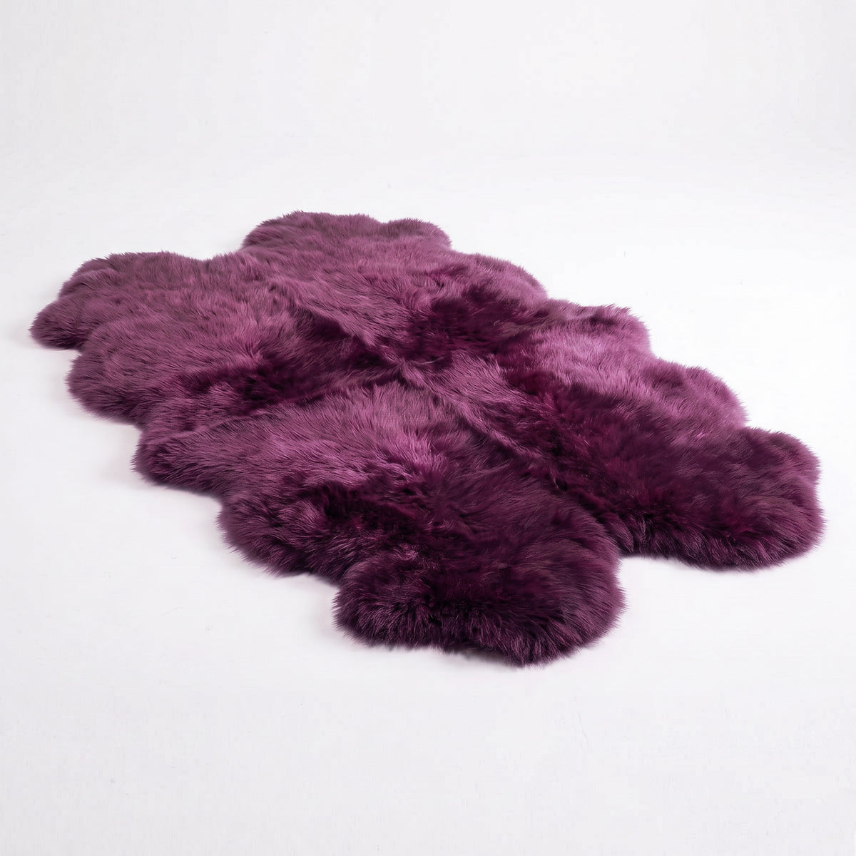 Purple (Hera) New Zealand sheepskin quad rug, studio shot