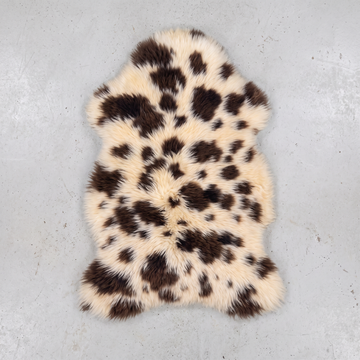 Printed Jacob single sheepskin pelt flat-lay on a pale grey floor