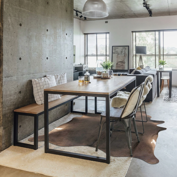 Natural cowhide rug styled on the floor of an editorial interior room