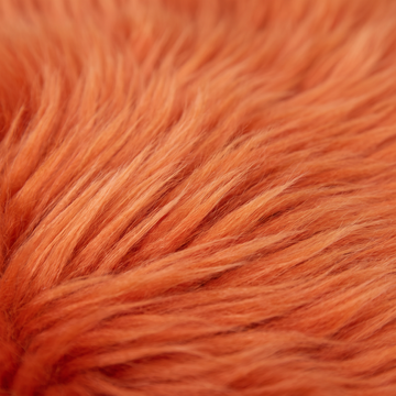 Close-up of Burnt Orange long wool sheepskin fibres