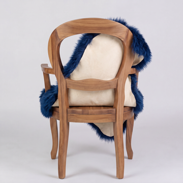 Cobalt Blue sheepskin over an armchair back, suede leather underside facing the camera