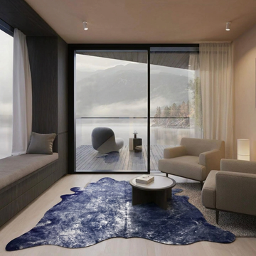 Indigo metallic cowhide rug styled on the pale wood floor of a modern minimalist lakeside lounge