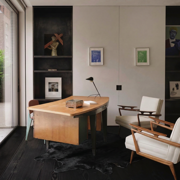 Warm caramel solid natural cowhide rug styled on the floor of an editorial interior