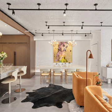 Caramel and ivory exotic printed cowhide rug styled on the floor of an editorial interior