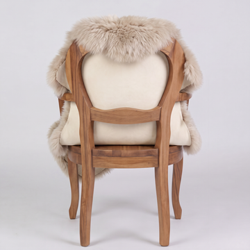 Oyster sheepskin over an armchair back, suede leather underside facing the camera