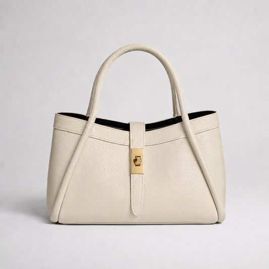 Bianca Leather Mini Bag by Clemés in Cream, three-quarter studio shot on grey background
