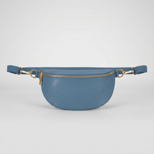Romy leather crossbody bum bag in Denim Blue on light grey studio background