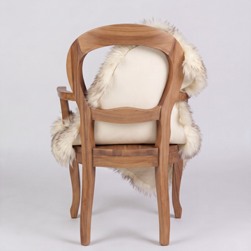 Wolf Tip sheepskin over an armchair back, suede leather underside facing the camera